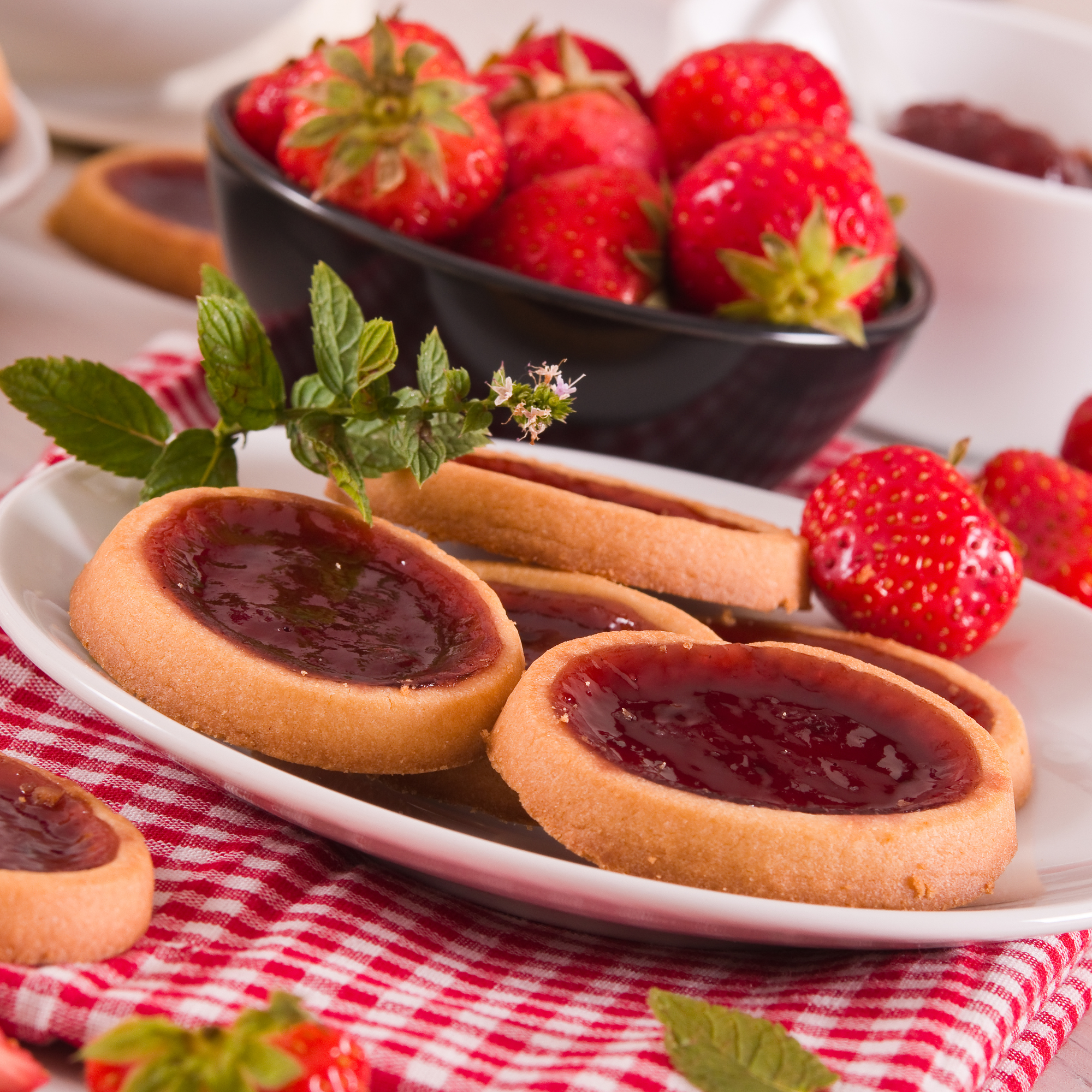 Strawberry hand pie with jam peeking through the crust